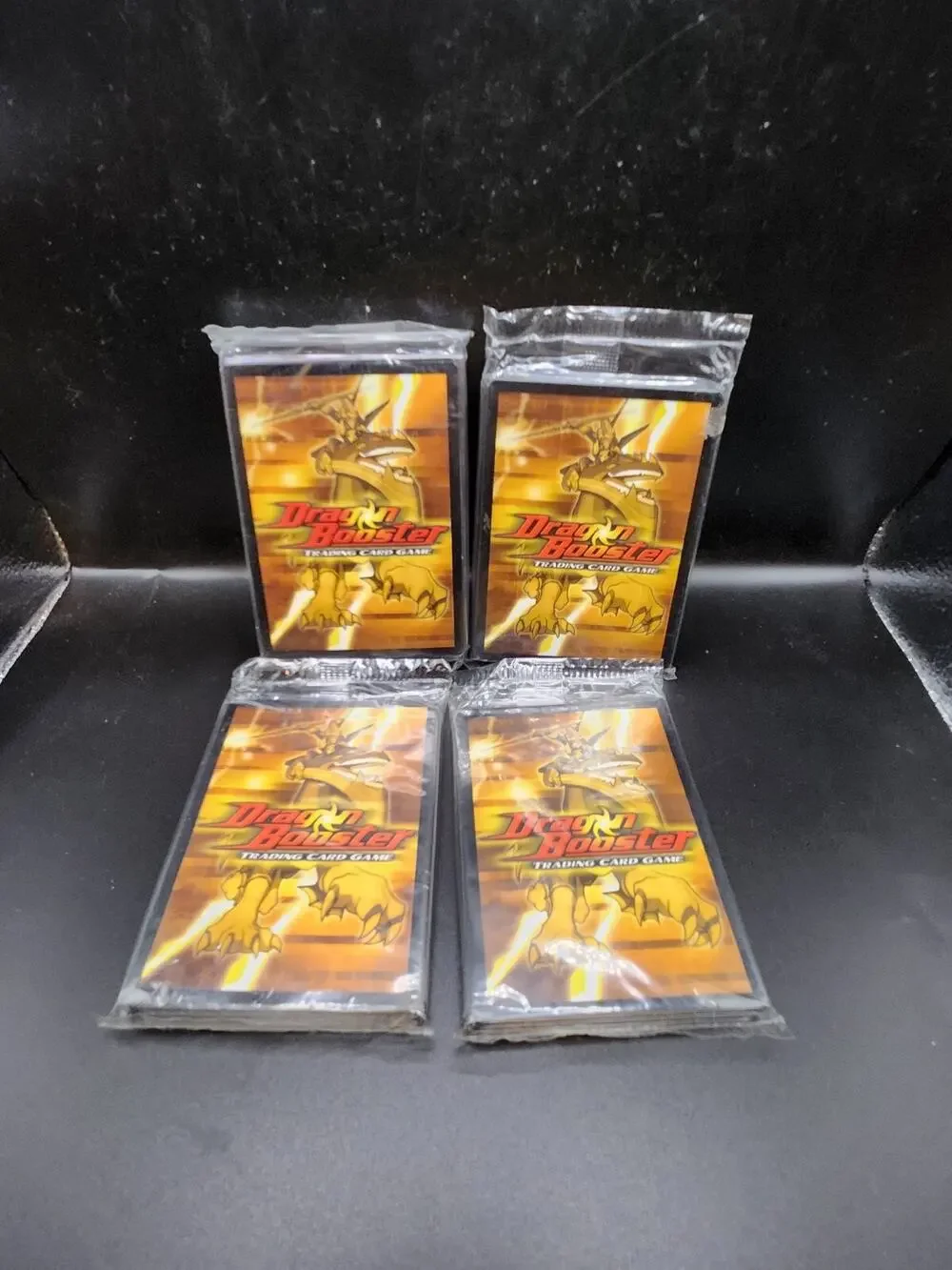 DRAGON BOOSTER TRADING CARD GAME DEMO GAME SEALED PACK NM CARDS. 4 Packs